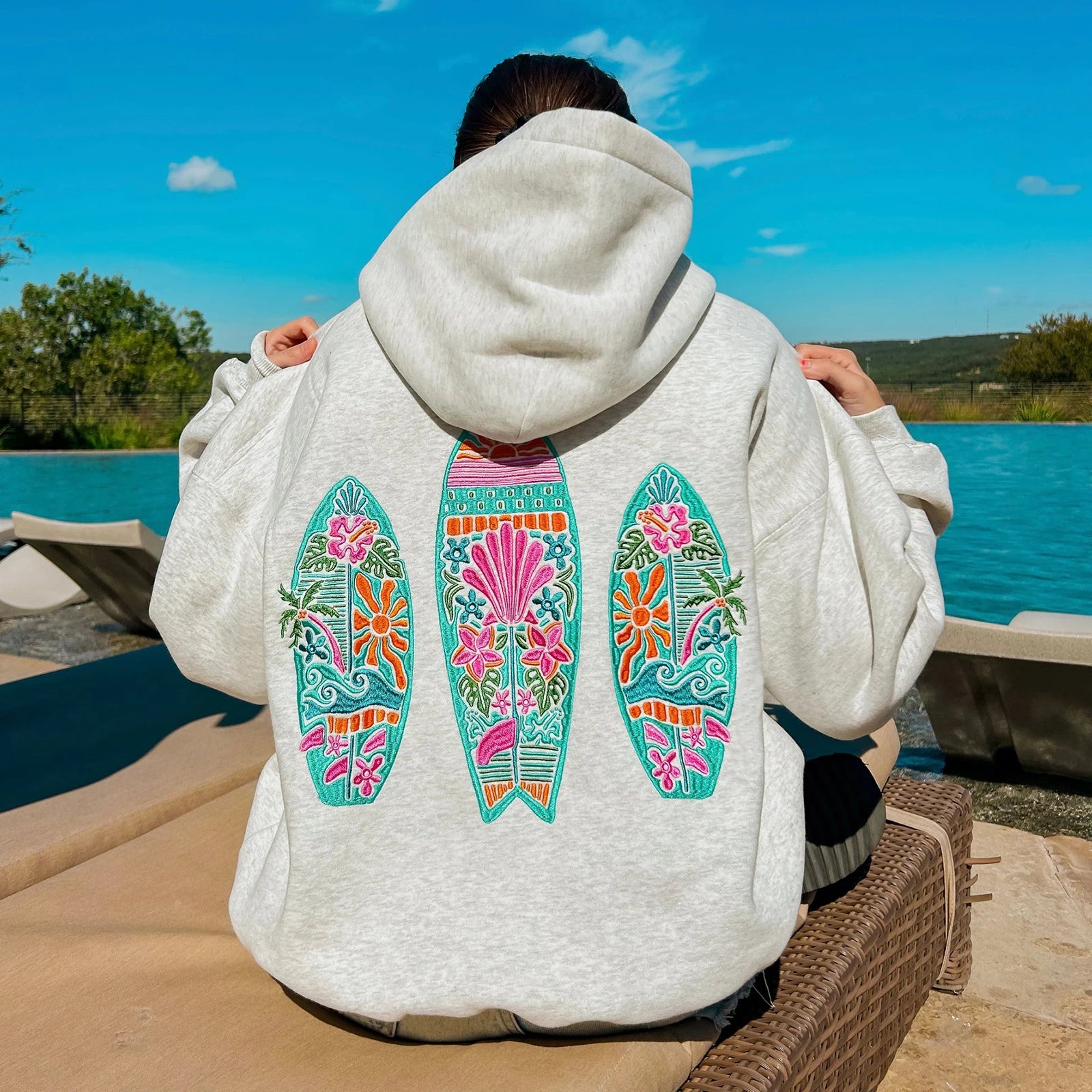 Women's surf board embroidered hoodie in a loose fit.
