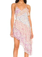 Woman wearing a floral dress with ruffled layers on a white background