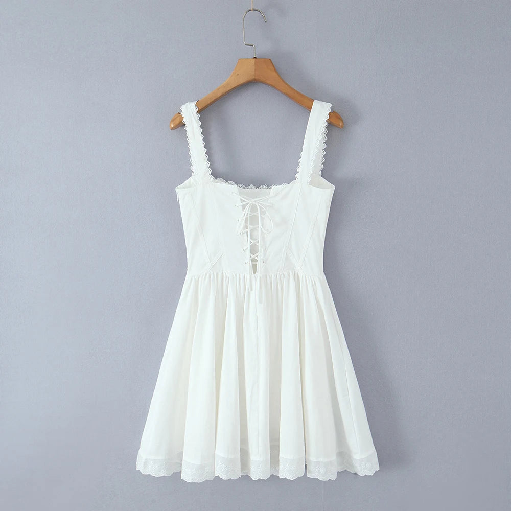 Women's white solid mini dress with a corset bodice and ruffled straps.