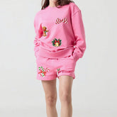 Pink outfit with festive designs