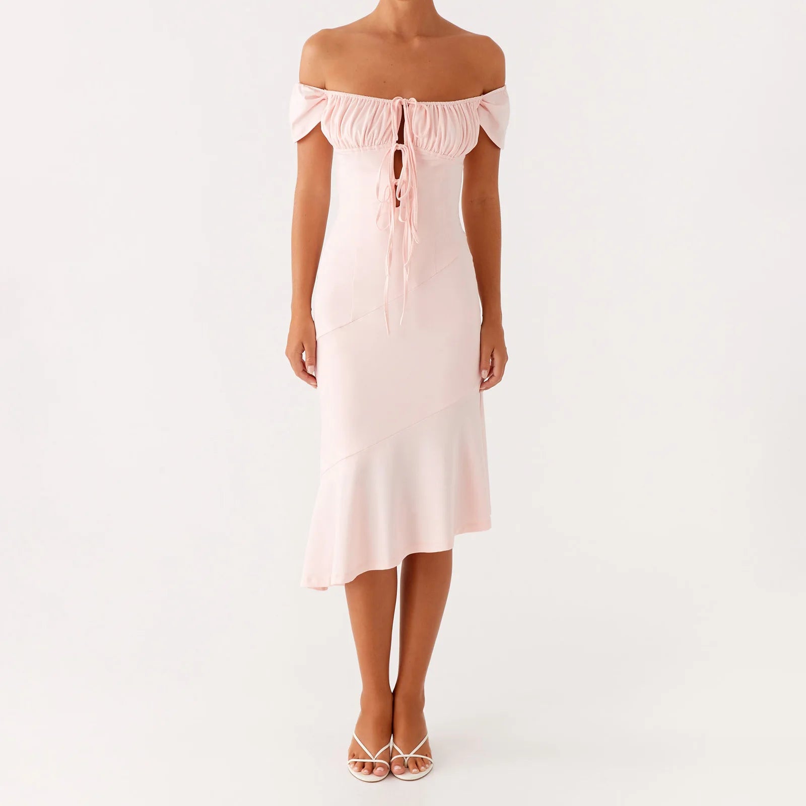 Woman wearing a light pink off-shoulder dress