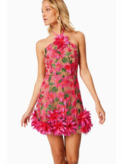 Woman wearing a pink floral dress on a white background