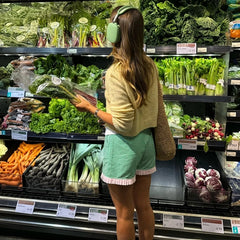 Women's charming green plaid shorts with ruffled hem.