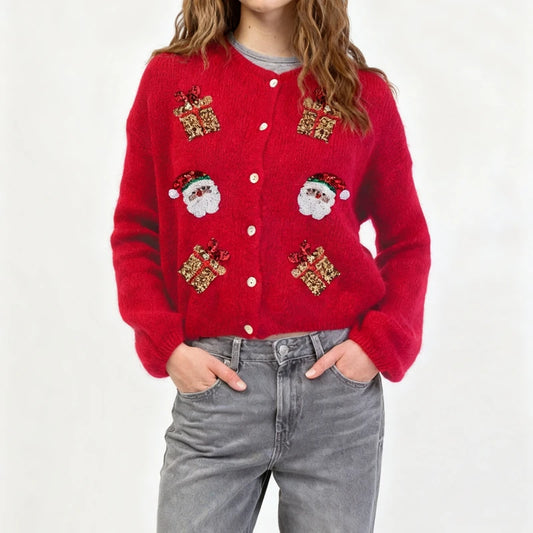 Red cardigan with festive designs on a white background