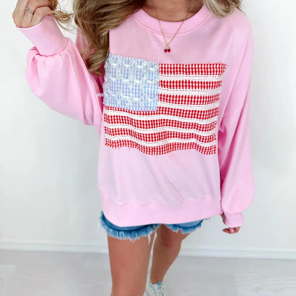 Pink sweatshirt with American flag design worn by a person