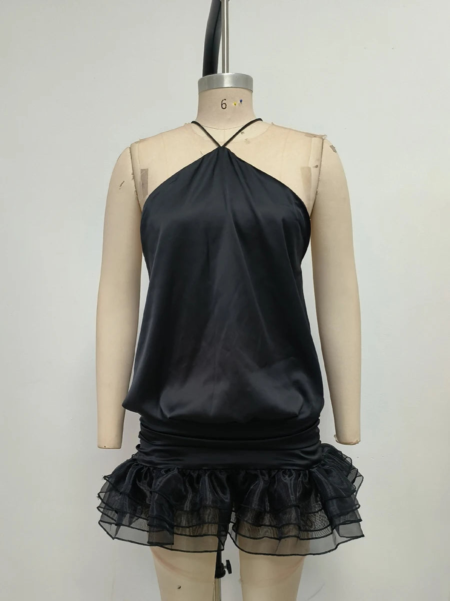 Women's black halter open back mini dress with a vintage sheath style.