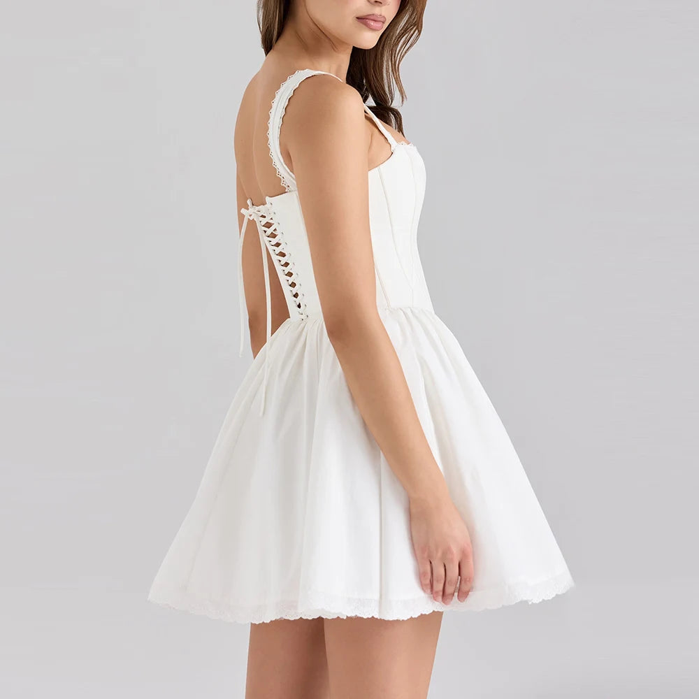 Women's white solid mini dress with a corset bodice and ruffled straps.