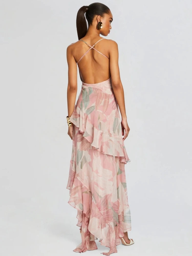 Woman wearing a pink floral dress with a white background