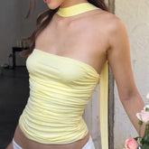 Women's ruched tube top in a solid color with a matching scarf.