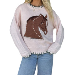 Person wearing a sweater with a horse design on a white background