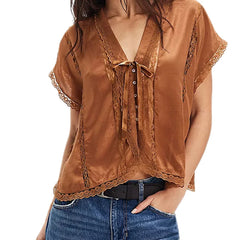 Brown lace-up top worn by a person