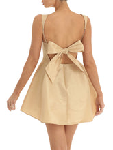Beige dress with a bow detail in back