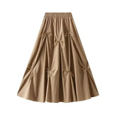 Beige skirt with tie details - pleated