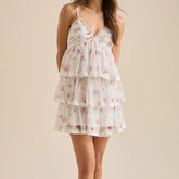 White floral dress on a beige background- front