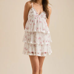 White floral dress on a beige background- front