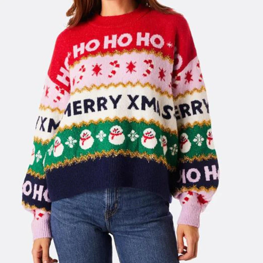 Person wearing a festive Christmas sweater with 'HO HO HO' and 'MERRY XMAS' text.
