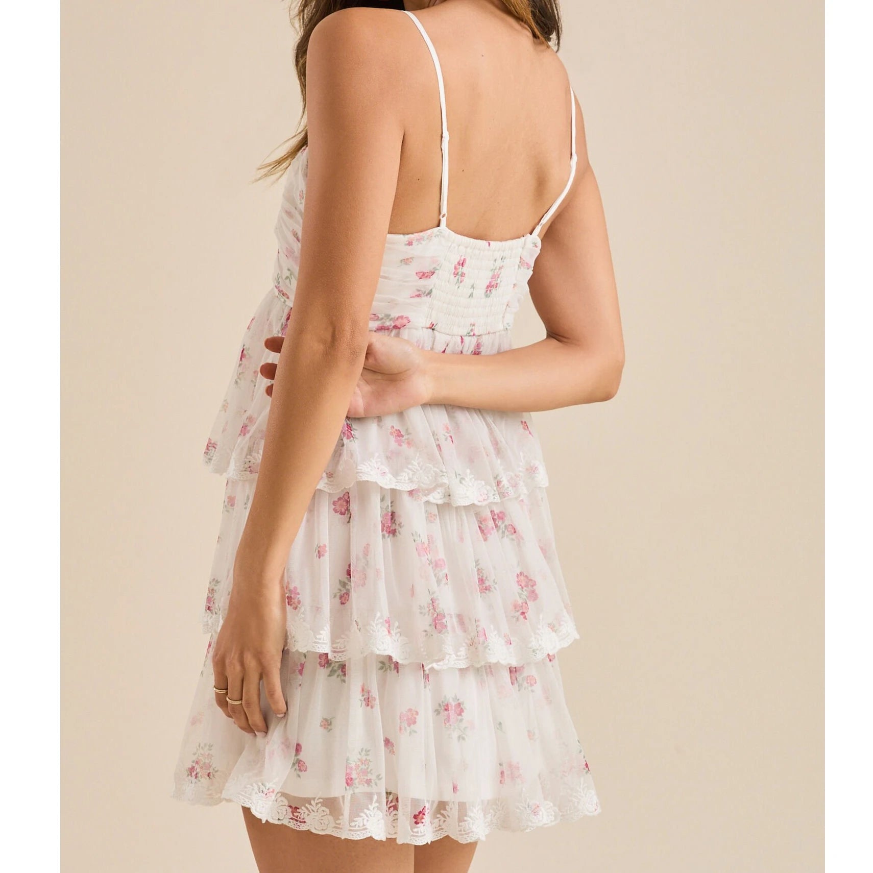 Woman wearing a floral tiered dress -back