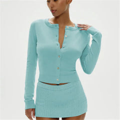 Woman wearing a light blue long-sleeve cardigan over a matching skirt