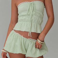 Women's green bandeau tube top and matching plaid shorts set.