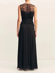 Black evening gown with lace detailing on a white background