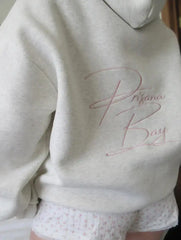 Women's bow embroidery hoodie in a loose fit.