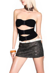 Women's black strapless spliced top with metal buckle detail.