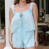 Light blue lace romper worn by a person outdoors.