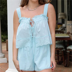 Light blue lace romper worn by a person outdoors.