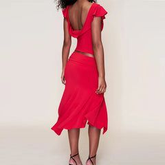 Red dress with cut-out design on a plain background