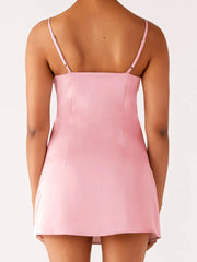 Pink slip dress worn by a person- back