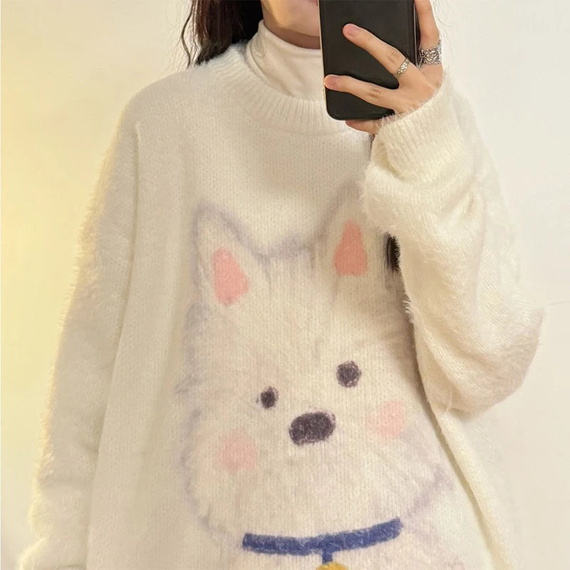 Person wearing a white sweater with a cartoon dog face design.