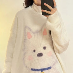 Person wearing a white sweater with a cartoon dog face design.