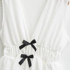 White V-neck Sleeveless Bow Bud Hem Top