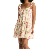 Woman wearing a floral dress - full view