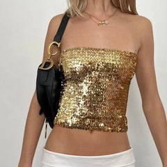Gold sequin top worn by a model- close-up