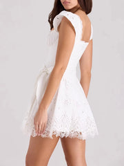 Women's white solid mini dress with a corset-style bodice, ruffled straps, and an A-line skirt.