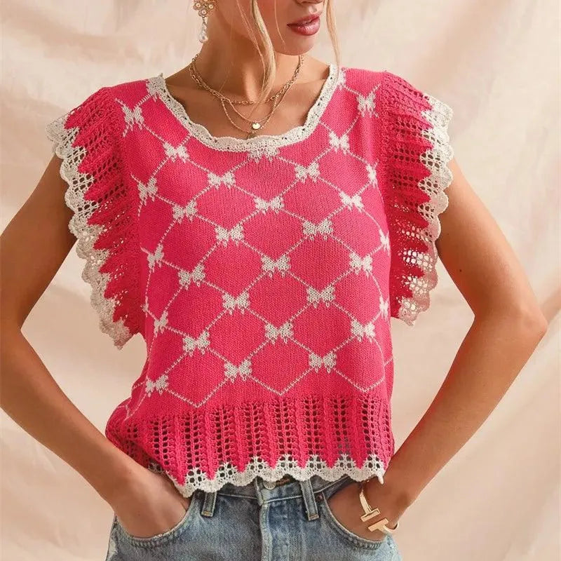 Woman wearing a pink crochet top with white trim on a beige background