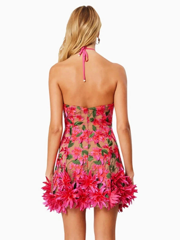 Woman wearing a floral dress with pink flowers on a white background