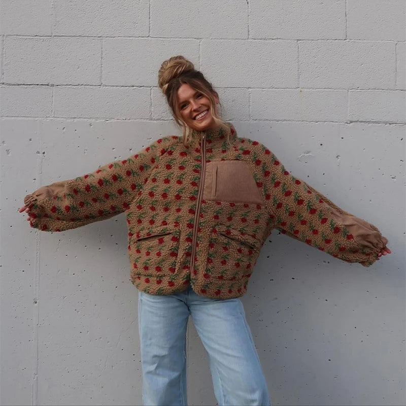 Person wearing a patterned jacket and jeans