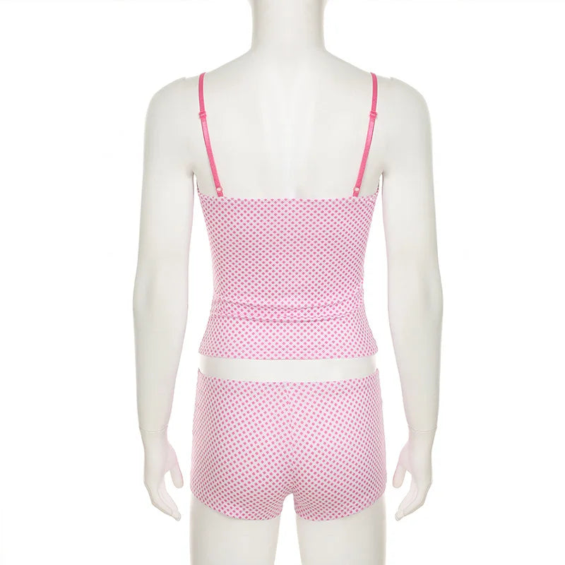 Mannequin wearing a pink polka dot swimsuit