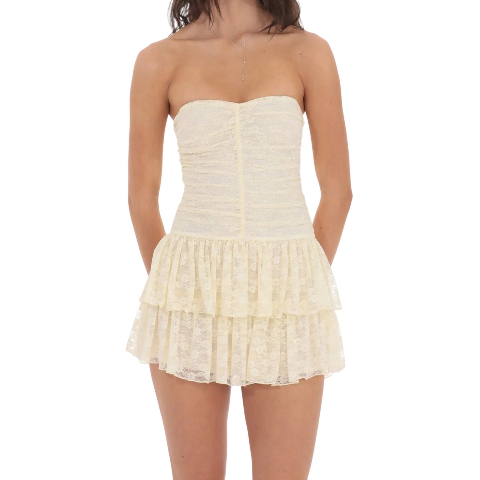 Woman wearing a strapless, ruffled cream dress- styled