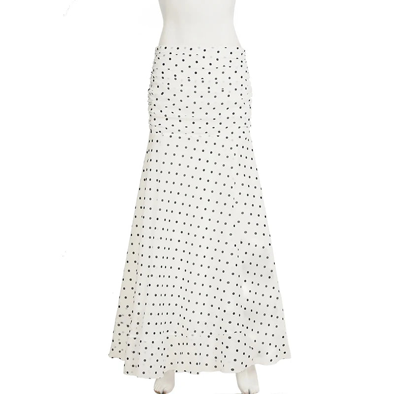 White dress with black polka dots on a white background