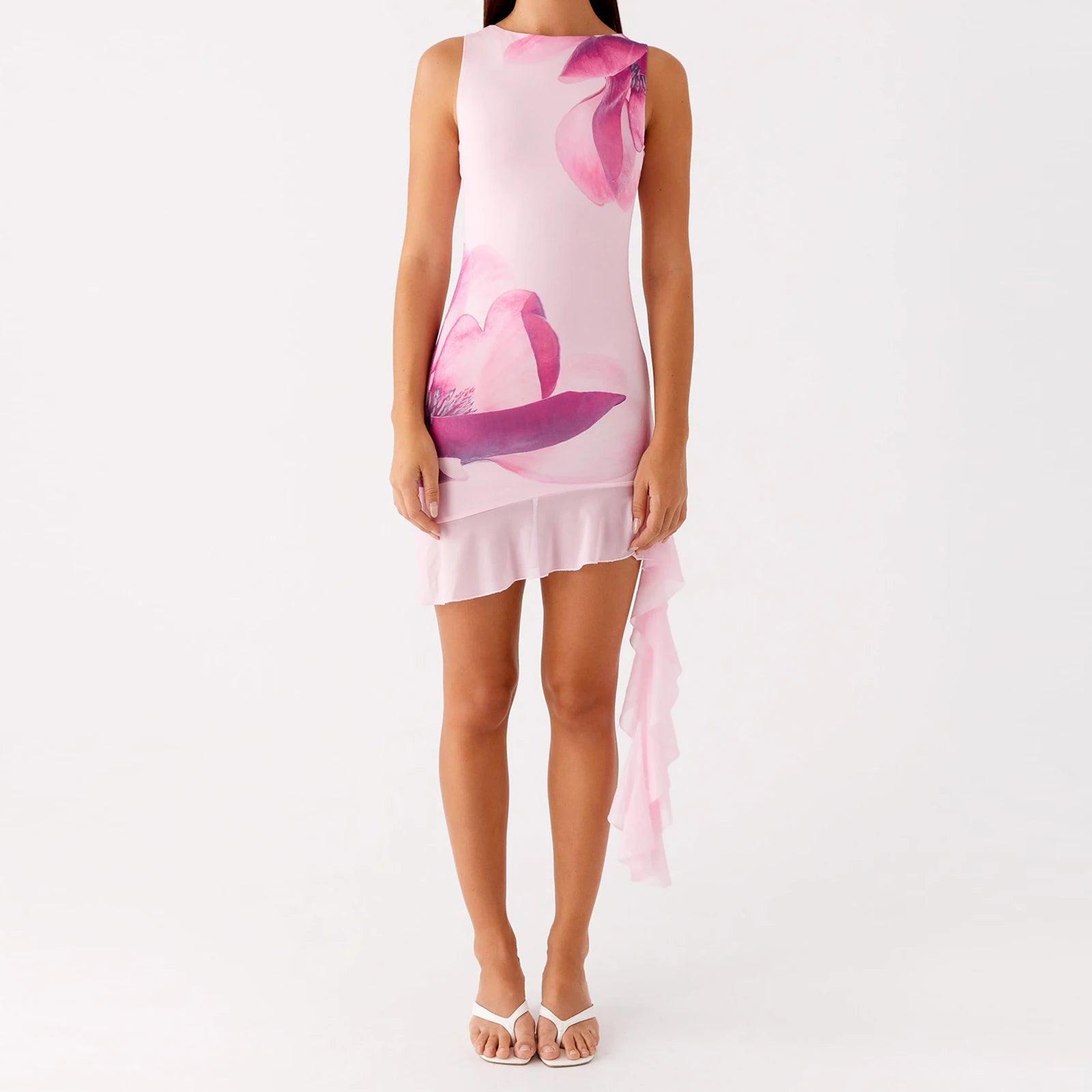 Woman wearing a pink dress with floral design