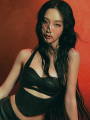 Woman wearing a black dress with cut-out design