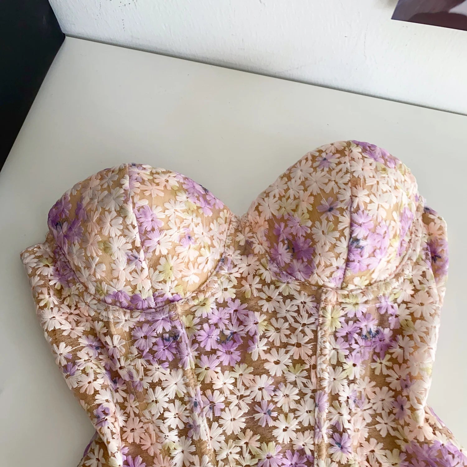 Floral-patterned garment on a white surface