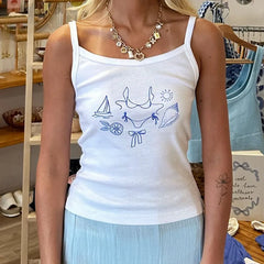 Person wearing a white tank top with blue graphics in a store setting