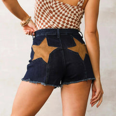 Denim shorts with star-shaped cutouts on a neutral background