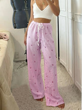Women's pink striped high-waist lounge pants.