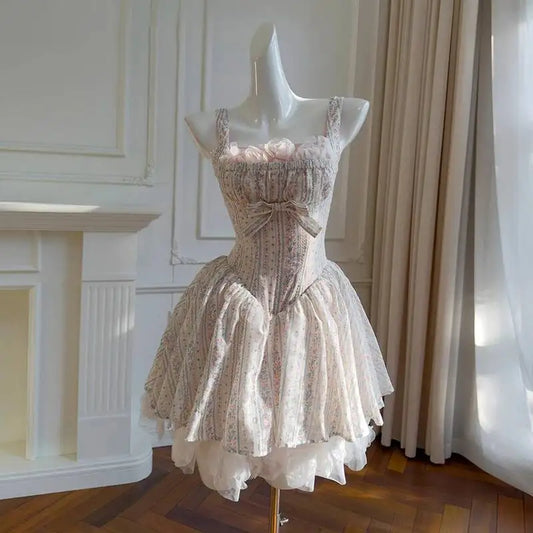 Mini dress on mannequin with sweetheart square neckline and floral print bodice.