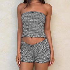 Women's black plaid smocked tube top and matching shorts set.